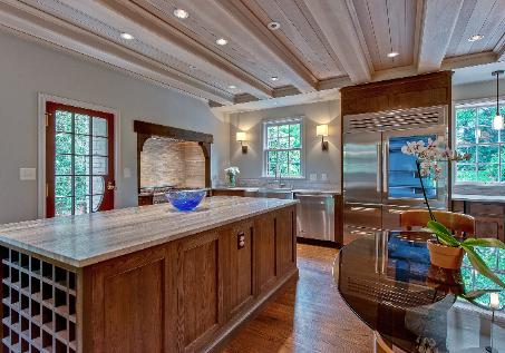 Wormy chestnut cabinetry and travetine countertops (click for photos)